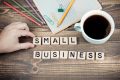Small Business. Wooden letters on the office desk, informative and communication background