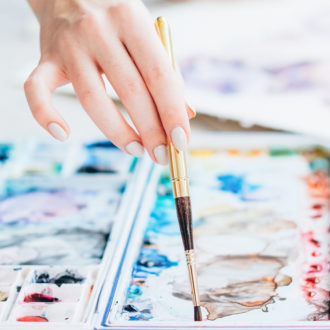 art school woman mixing paint colors brush palette